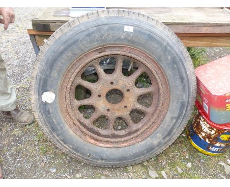 A vintage 700-20 lorry wheel and tyre, artillery type (tyre has good tyre depth).