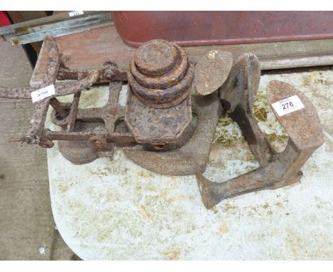 A set of balance scales and weights and two shoe lasts.
