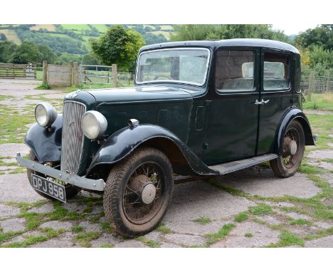 A 1936 Austin 10 Lichfield saloon, Registration No. DPJ 958, finished in dark green and black. First registered on 07/04/1936