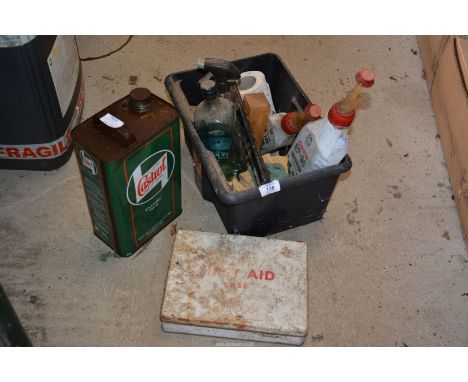 A Castrol oil Tin, a First Aid kit and various fluids.