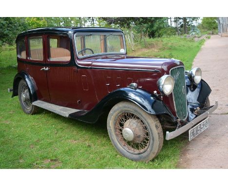 A 1936 Austin 12 Ascot Saloon, Registration No. EY 5523, finished in maroon and black, the V5 shows that she was first regist