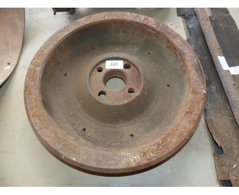 A heavy vintage flywheel, 14 1/2'' diameter x 2 1/4'' thick.