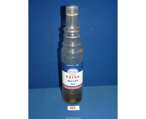 An Esso Extra motor oil glass bottle  12" tall.
