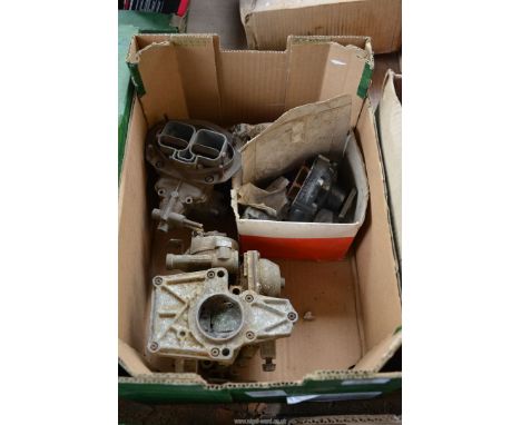 A box containing a Water Pump (believed Ford), a Ford twin choke carburettor and a Ford carburettor (all unused).