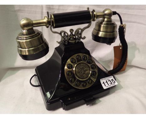 The Duke is a 1920s style push button telephone with a black &amp; brass finish and traditional cloth handset curly cord. Com