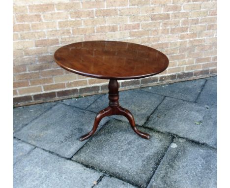 A MAHOGANY TILT-TOP TRIPOD OCCASIONAL TABLE  the circular top 83cm diameter