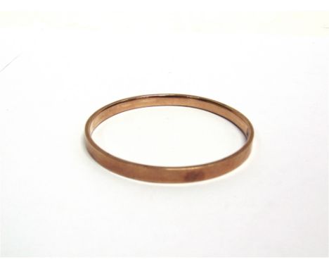 A 9 CARAT GOLD HOLLOW BANGLE  plain design, 6mm wide, internal diameter 6.9cm, 8.6g gross
