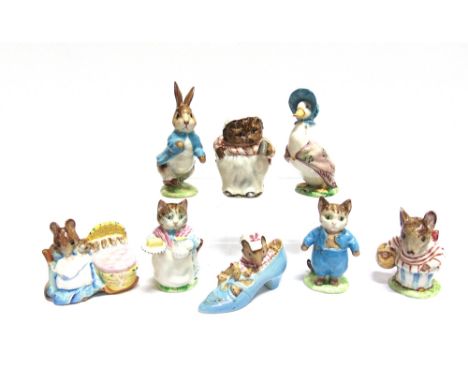 A GROUP OF EIGHT BESWICK BEATRIX POTTER FIGURES  all with gold backstamps: 'Ribby', 'Tom Kitten', 'Peter Rabbit', 'Jemima Pud