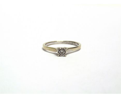 A 9 CARAT WHITE GOLD SINGLE STONE DIAMOND RING  the illusion set brilliant cut of approximately 0.15 carats, finger size R, 2