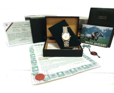 ROLEX OYSTER PERPETUAL DATEJUST  a gentleman's two colour bracelet watch, the yellow dial with gilt batons, hands and centre 