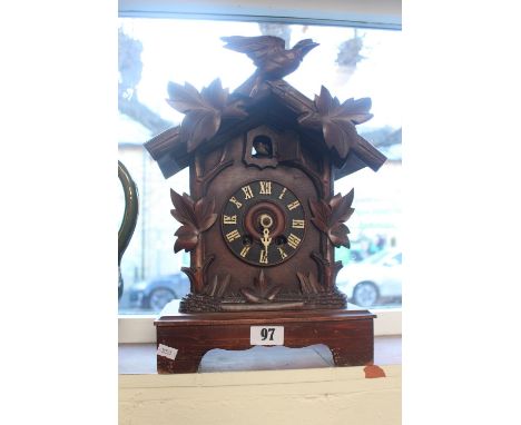 Large Black Forest carved bracket clock with roman numeral dial 