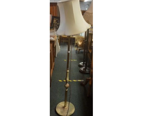 AN ONYX &amp; BRASS EFFECT STANDARD LAMP WITH SHADE