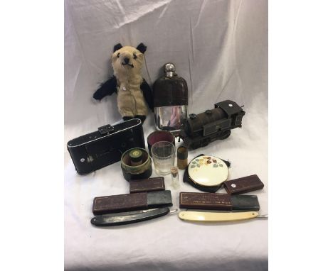 CARTON WITH BELLOWS CAMERA, CLOCK WORK ENGINE, HIP FLASK &amp; RAZORS