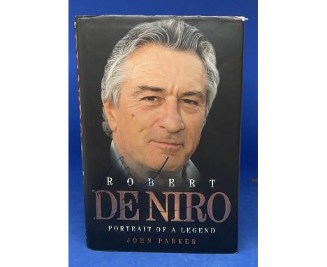 Robert De Niro signed hardback book titled De Niro portrait of a legend signature on front cover. Good condition. All autogra