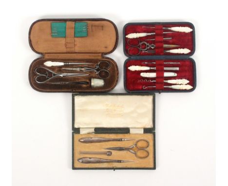 Three English cased sewing sets, comprising a leather cased set of rounded end rectangular form with thimble, two pairs of sc