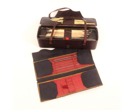 A 19th Century leather netting box and a leather knitting and netting case, the first in maroon leather of rectangular form w