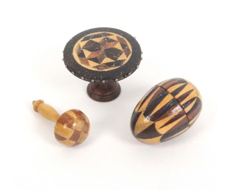 Tunbridge ware – three pieces, comprising a stick ware egg form thimble case with later thimble, 4cms, a stick ware pin wheel