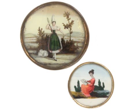Two 19th Century French circular bonbonnieres, one with domed reverse glass picture of a woman in traditional costume holding