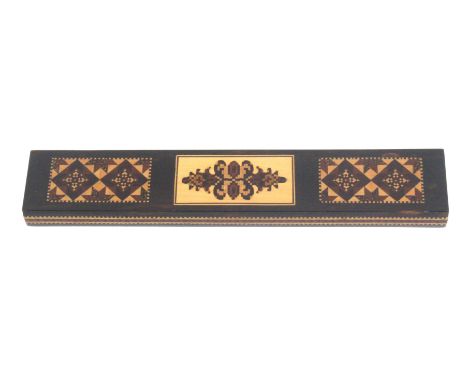 A Tunbridge ware skein case, of rectangular form in coromandel wood, one side with a central mosaic panel flanked by stick wa