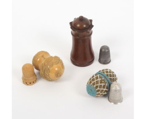 Three thimble cases, comprising an early 19th Century bone egg covered in coloured beadwork trellis and containing a silver t