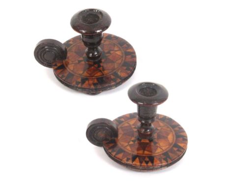 Two similar miniature Tunbridge ware candle holders, of chamber stick form each on three turned feet with a circular stick wa