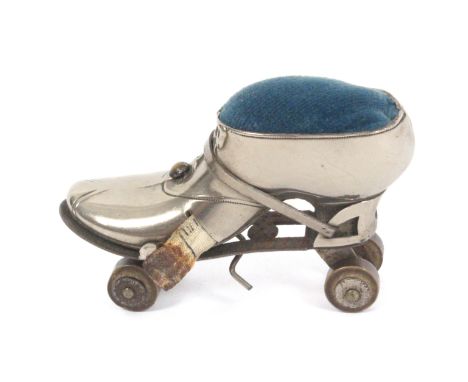 A scarce novelty combination tape measure and pin cushion in the form of a roller skate, engraved to one side ‘A.J. Ward, 191