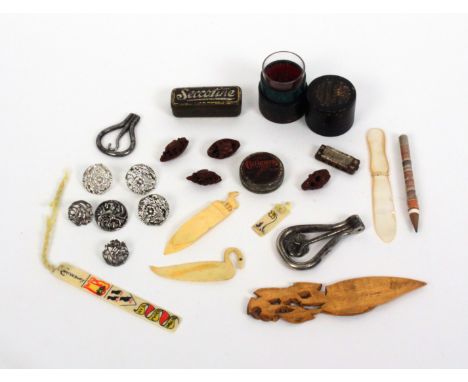 A mixed lot, comprising four miniature carved oriental nuts, two as boats, 3cms, a miniature harmonica, 3.5cms, four various 