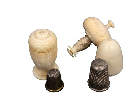 Two 19th Century ivory thimble cases, comprising an acorn form example with internal reel and damaged silver thimble, 4.2cm, 