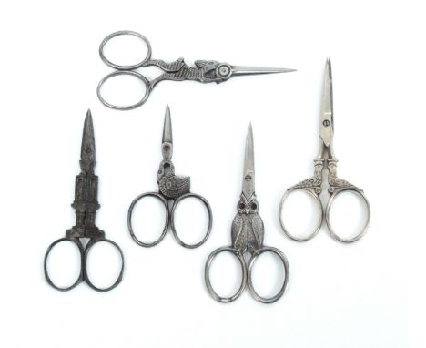 Five pairs of 19th Century animal and architectural steel scissors, comprising a pair in the form of a tower, 9cms, another p