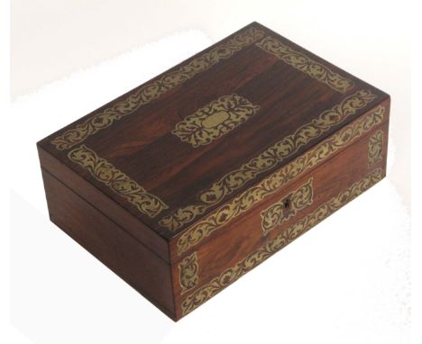 A mid Victorian rosewood rectangular sewing box with well fitted interior, the lid and front with cut brass borders, lid pane