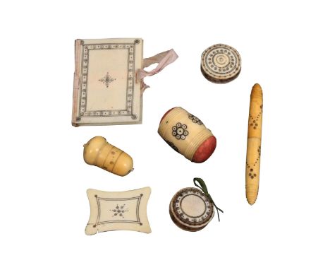 Seven 19th Century ivory Madras sewing tools, with burnt circle decoration comprising a needle book, 6.2cms, a thread winder,