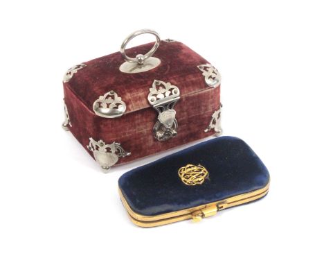 Two late 19th Century French sewing companions, comprising a rectangular example in plum velvet with open work plated mounts 