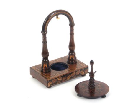 A Tunbridge ware watch stand and a ring stand, the first on a floral and geometric mosaic rectangular base raised on bun feet
