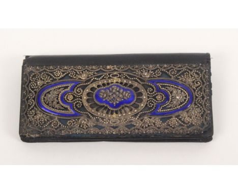 A 1920’s black leather purse, the flap mounted with a silver and blue enamel plaque of flowers, beaded scrolls and other moti