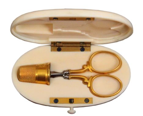 A late 19th Century French oval ivory etui, the lid with engraved motif, the flush fitted interior with engraved border silve