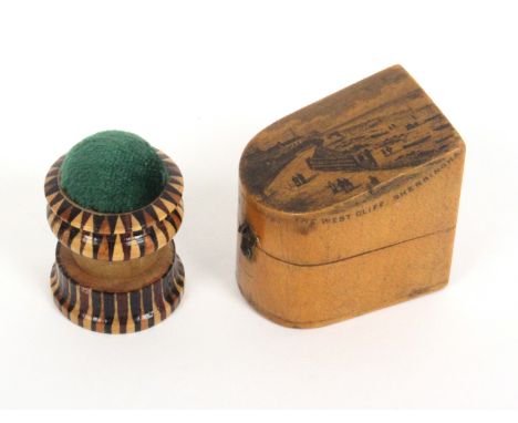 A combination Tunbridge ware waxer/pin cushion, and a Mauchline ware slant top thimble box, the first in stick ware with gree