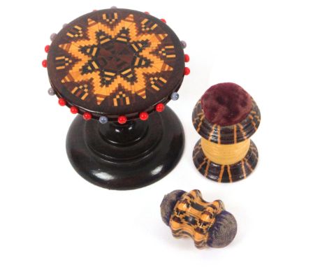 Tunbridge ware – sewing, three pieces, comprising a mosaic pin wheel on rosewood table base, 5.2cms dia., a double ended gird