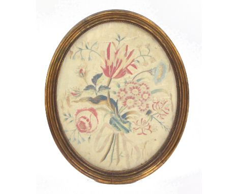 Three framed needleworks and a print, comprising an oval silk embroidered floral bouquet, some loss, 37cms, another silk work