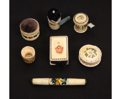 Seven 19th Century floral painted bone sewing tools, comprising a rectangular pin cushion ‘From Cheltenham’, 4.5cms, a disc f