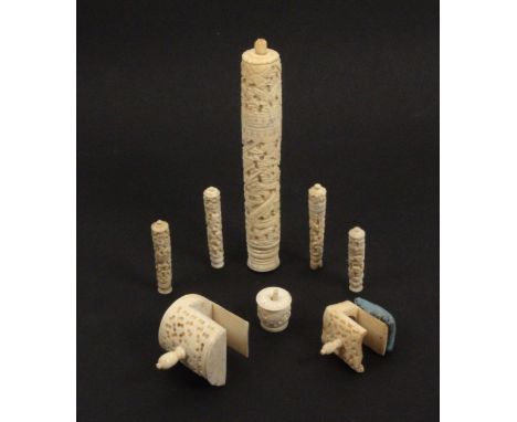 Eight Chinese export carved bone sewing tools, comprising a cylinder netting case, crack to top, 15.5cms, two sewing clamps, 