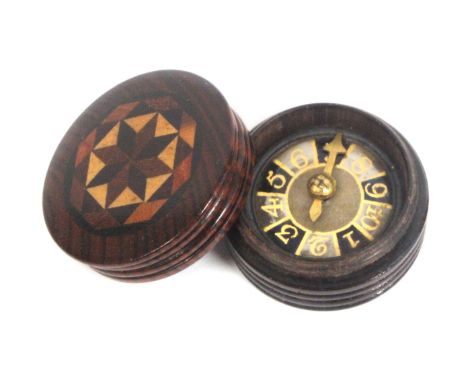 A scarce Tunbridge ware circular whist marker, the verre eglomise dial with brass hand contained in a turned rosewood box wit