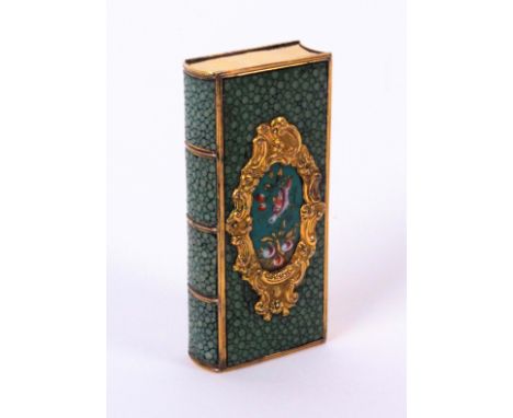 A good late 18th Century French etui in the form of a book, the covers and spine in green shagreen each with an oval enamel p