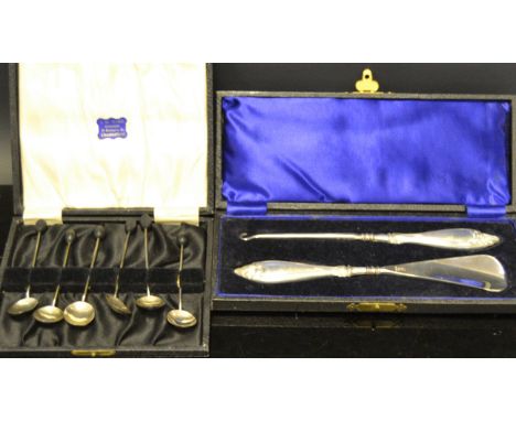 A set of six silver coffee bean spoons, Birmingham 1926;   a George V silver hafted shoe horn and button hook, Birmingham 193
