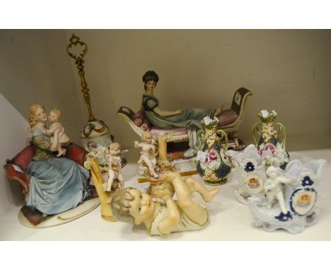 Continental Ceramics - a Nao bisque figural group of a lady reclining; a pair of bisque porcelain spill vases; a Capodimonte 