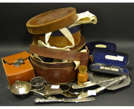 Silver backed hairbrush and comb set in leather case; 3 silver hafted knives; silver tea strainer; silver napkin ring; 3 pair