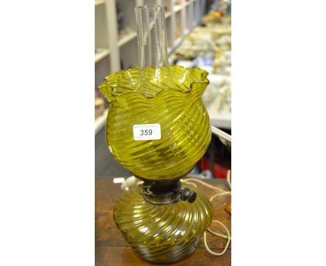 A Victorian glass oil lamp, converted to electricity, green glass shade c 1890