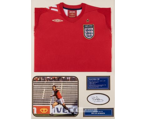 Bryan Robson signed England display,comprising red England retro jersey embroidered with national three lion emblem and Umbro