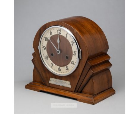 An Art Deco wooden cased mantel clock presented to the Arsenal footballer Jack Lambert,  set with a plaque reading PRESENTED 