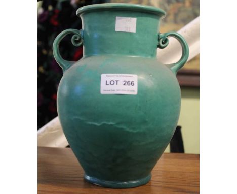 C.H. Brannam of Barnstable - An Arts &amp; Crafts pottery twin-handled vase, with running green glaze exterior, 21cm high