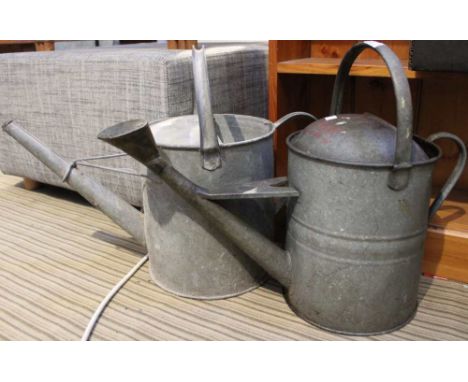 Two vintage metal watering cans